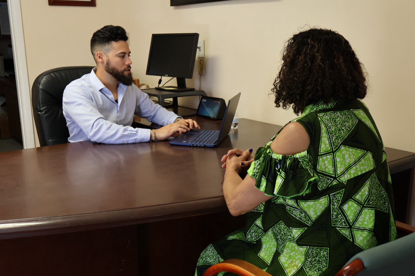 A&E Insurance Agency advisor reviewing Medicare coverage options with a South Florida client at the office
